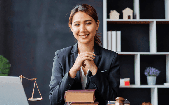 Female attorney smiling at her desk